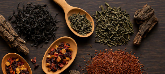 Assorted loose leaf teas and botanicals on a wooden table
