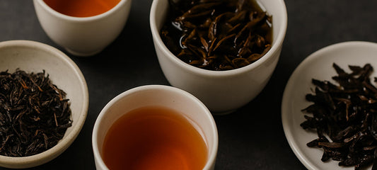 Dry and steeped tea leaves arranged with brewed tea