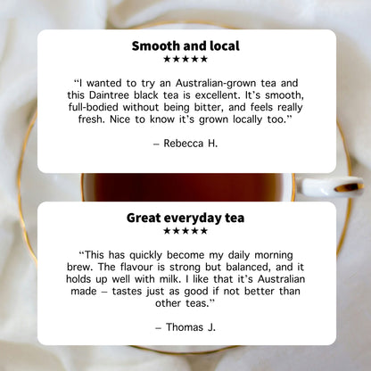 Reviews of Daintree black tea with a cup in the background