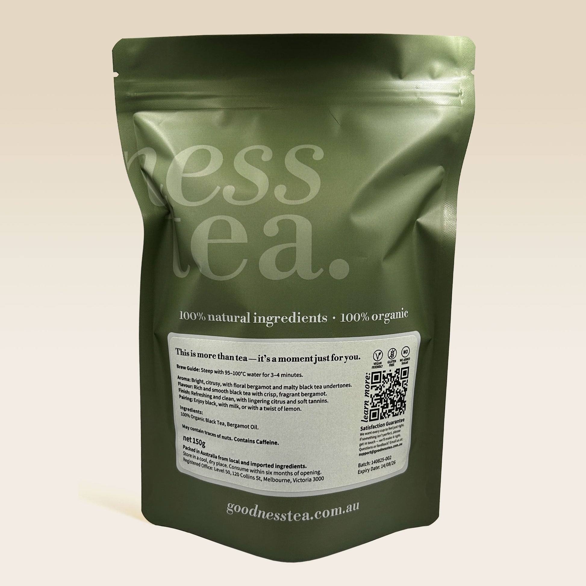 Green tea package with 'goodness tea' branding on a beige background