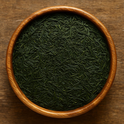 Wooden bowl filled with gyokuro tea leaves on a wooden surface