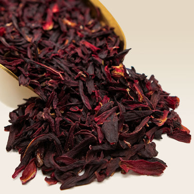 Dried hibiscus flowers on a beige background