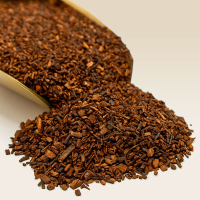 Close-up of Honeybush Tea with a scoop on a light background