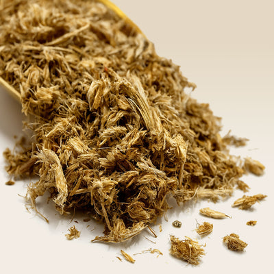 Close-up of dried Marshmallow Root on a white background