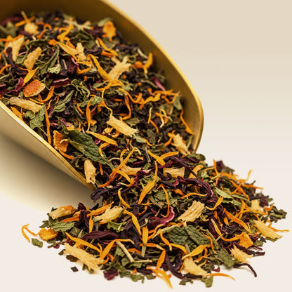 Loose Organic Pineapple Pop Fruit Tea in a brass scoop