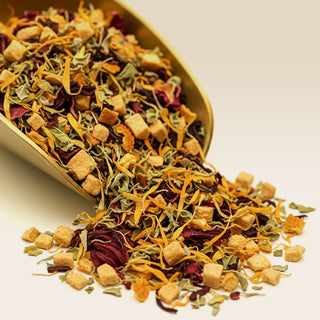 Loose Organic Turkish Apple Fruit Tea in a brass scoop